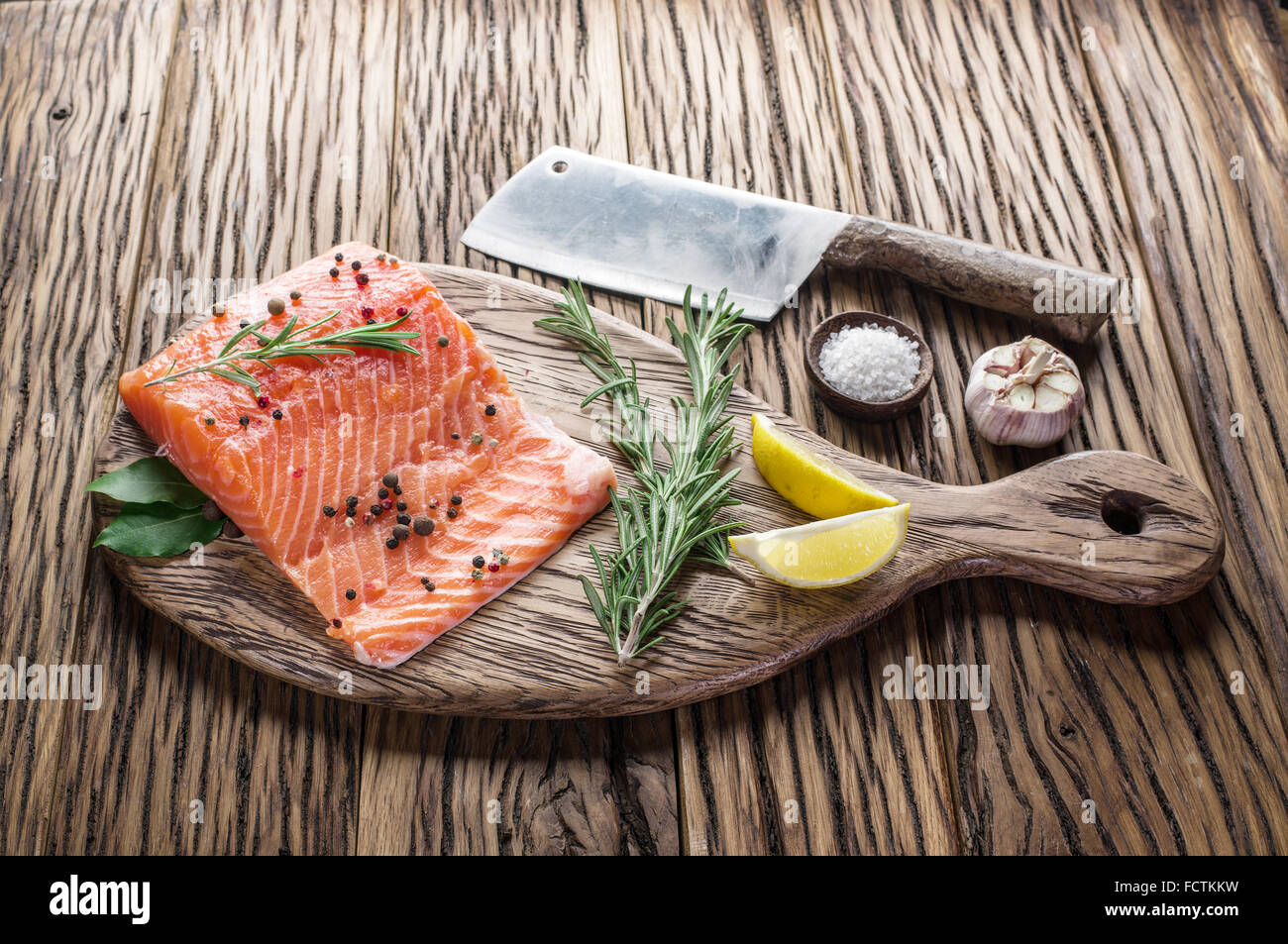 Fresh salmon on the cutting board. Cooking process. Stock Photo