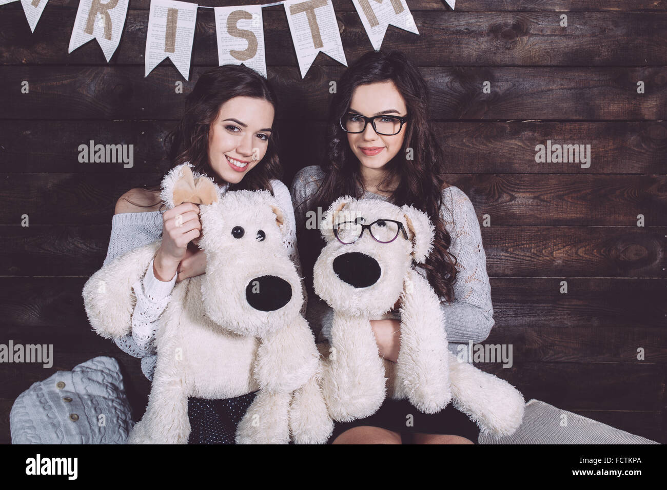 Two charming girls playing Stock Photo - Alamy