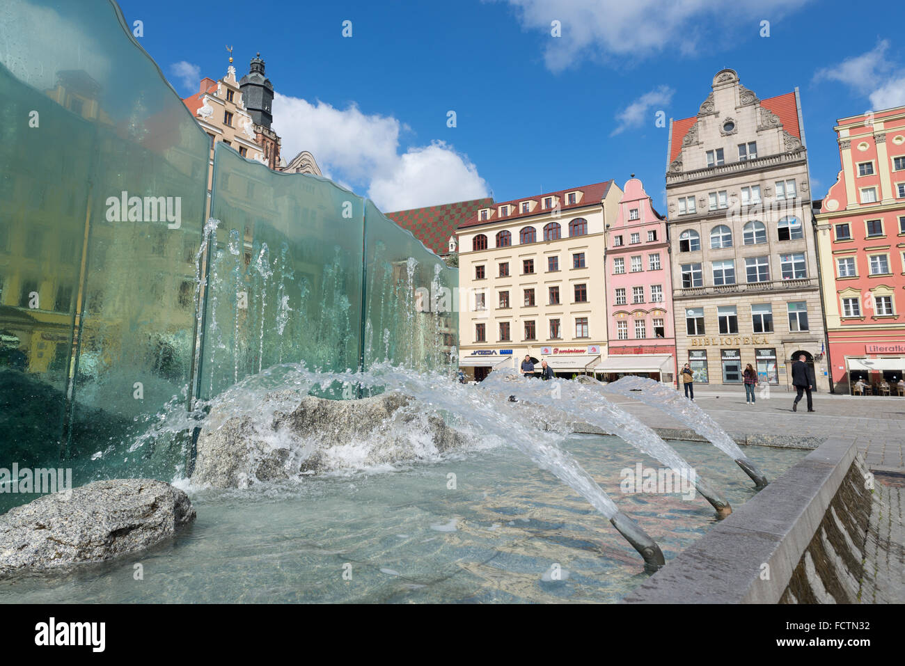 The contemporary-styled fountain in the historic market square of Wroclaw with its facades of Gothic, Renaissance, Baroque. Stock Photo