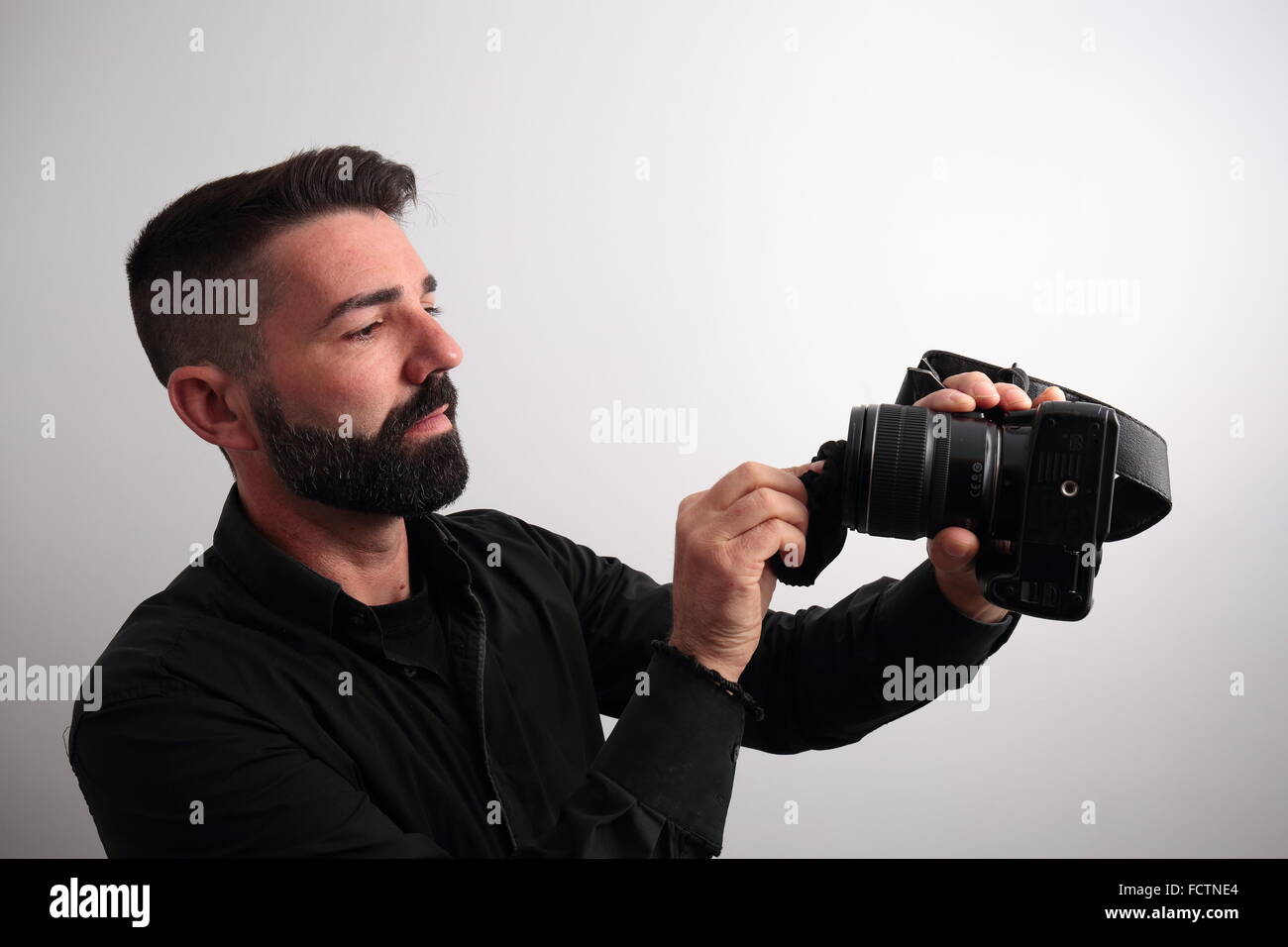 Man cleaning the camera lens Stock Photo Alamy