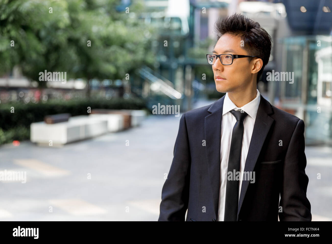 Businessman outdoors in city business district Stock Photo - Alamy