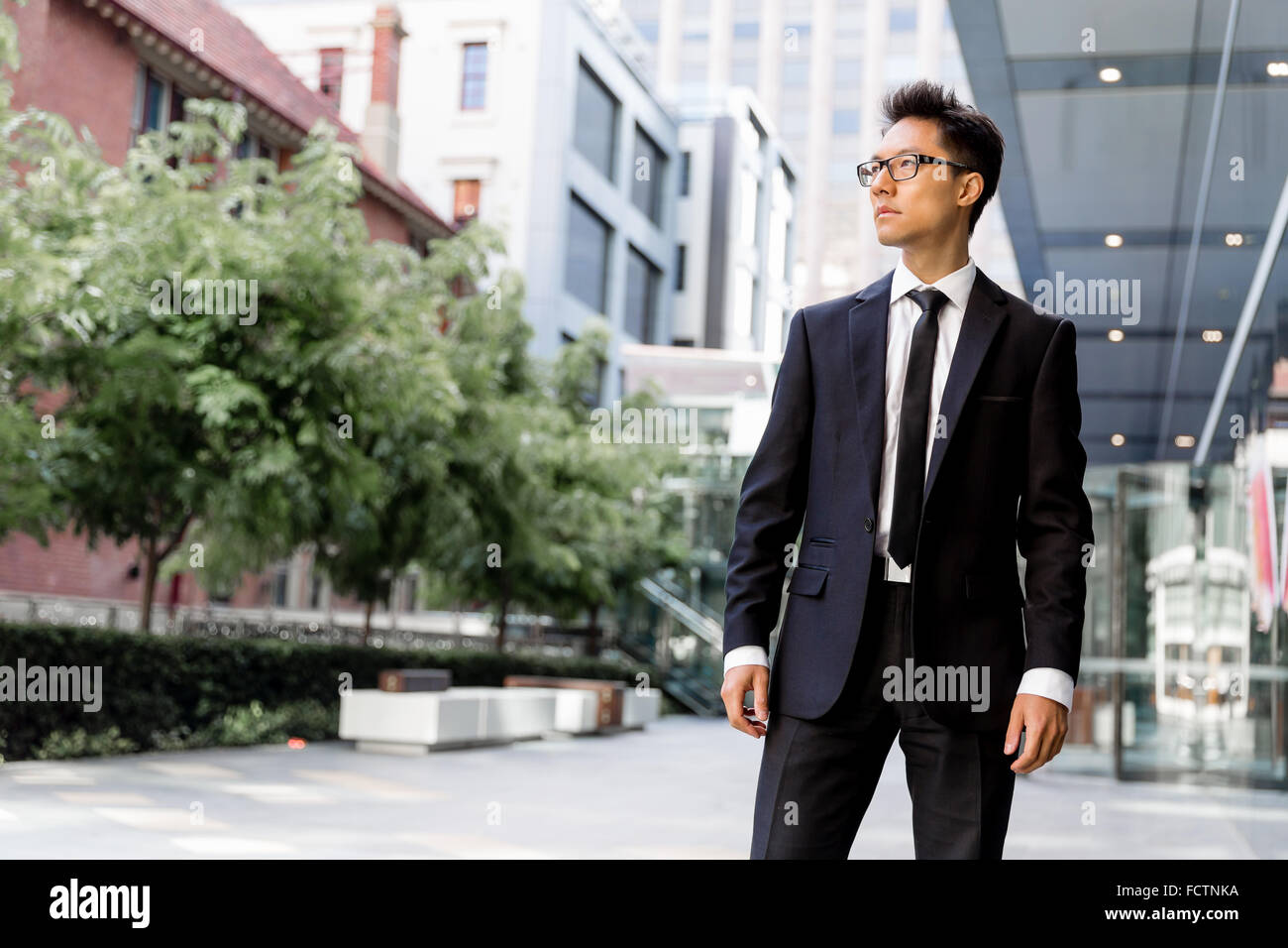 Businessman outdoors in city business district Stock Photo - Alamy