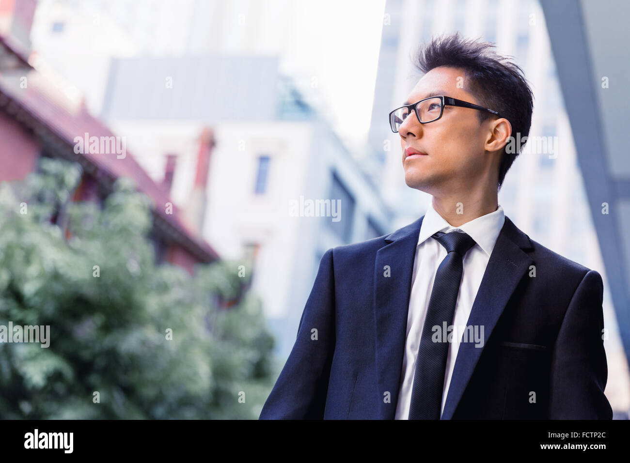 Businessman outdoors in city business district Stock Photo - Alamy