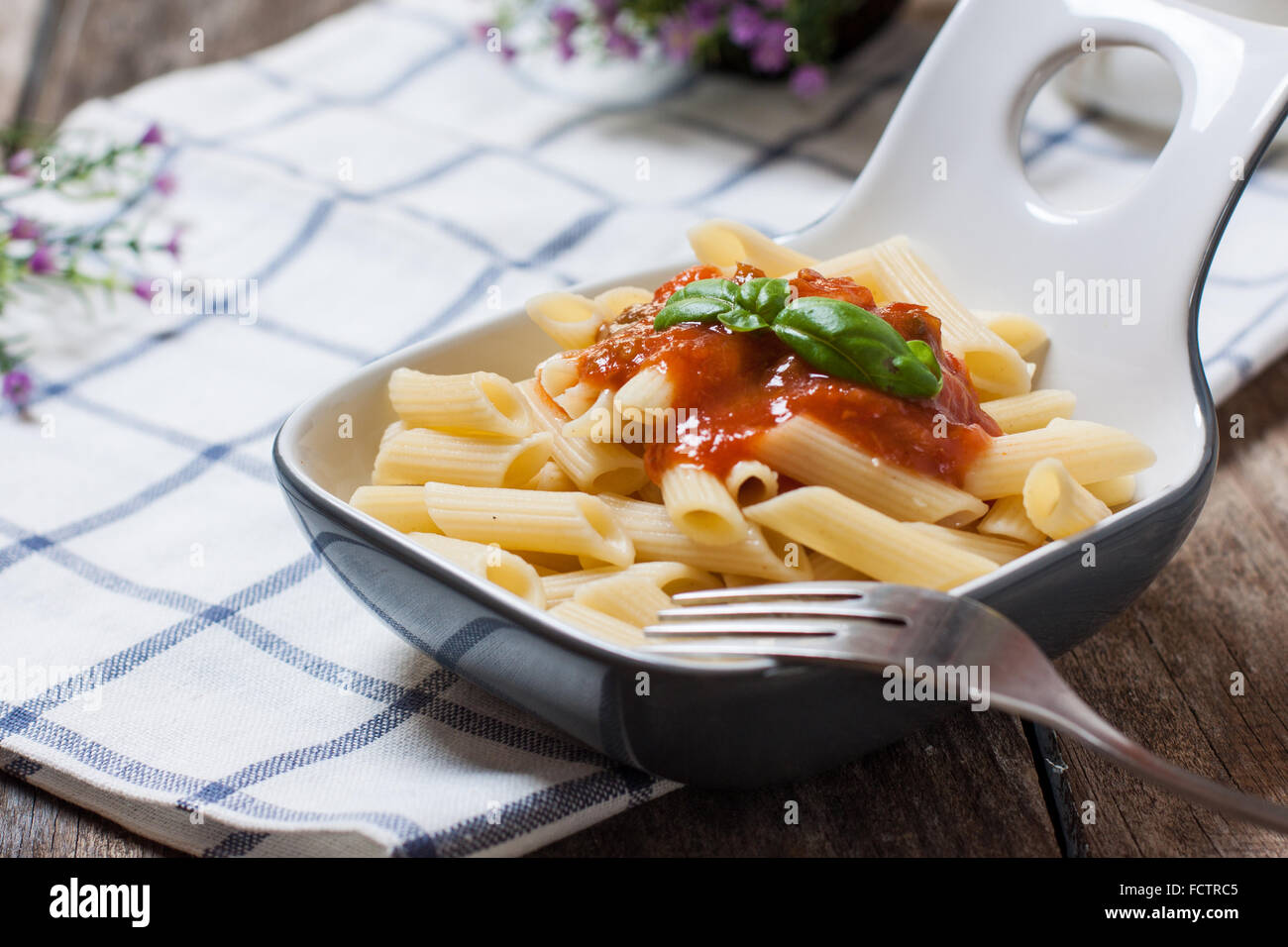 macaroni pasta with tomato sauce and basil Stock Photo - Alamy