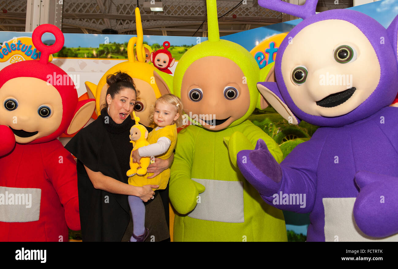 Olympia, London, UK. 25th January, 2016. The Teletubbies appear on the Character Options stand to promote the launch of the new Teletubbies toys. The 63rd annual British Toy Fair takes place at Kensington Olympia in London with over 270 companies showcasing thousands of new product launches of toys, games and hobbies to the trade. Credit:  Malcolm Park editorial/Alamy Live News Stock Photo