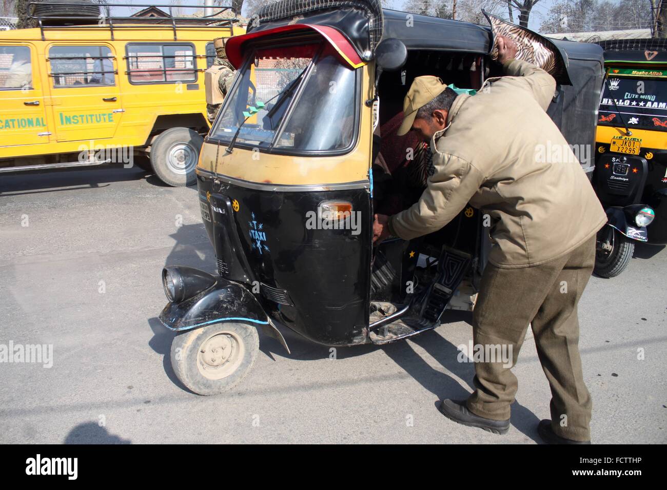 Indian policemen checks Auto rickshaw in srinagar ahead of republic day ...