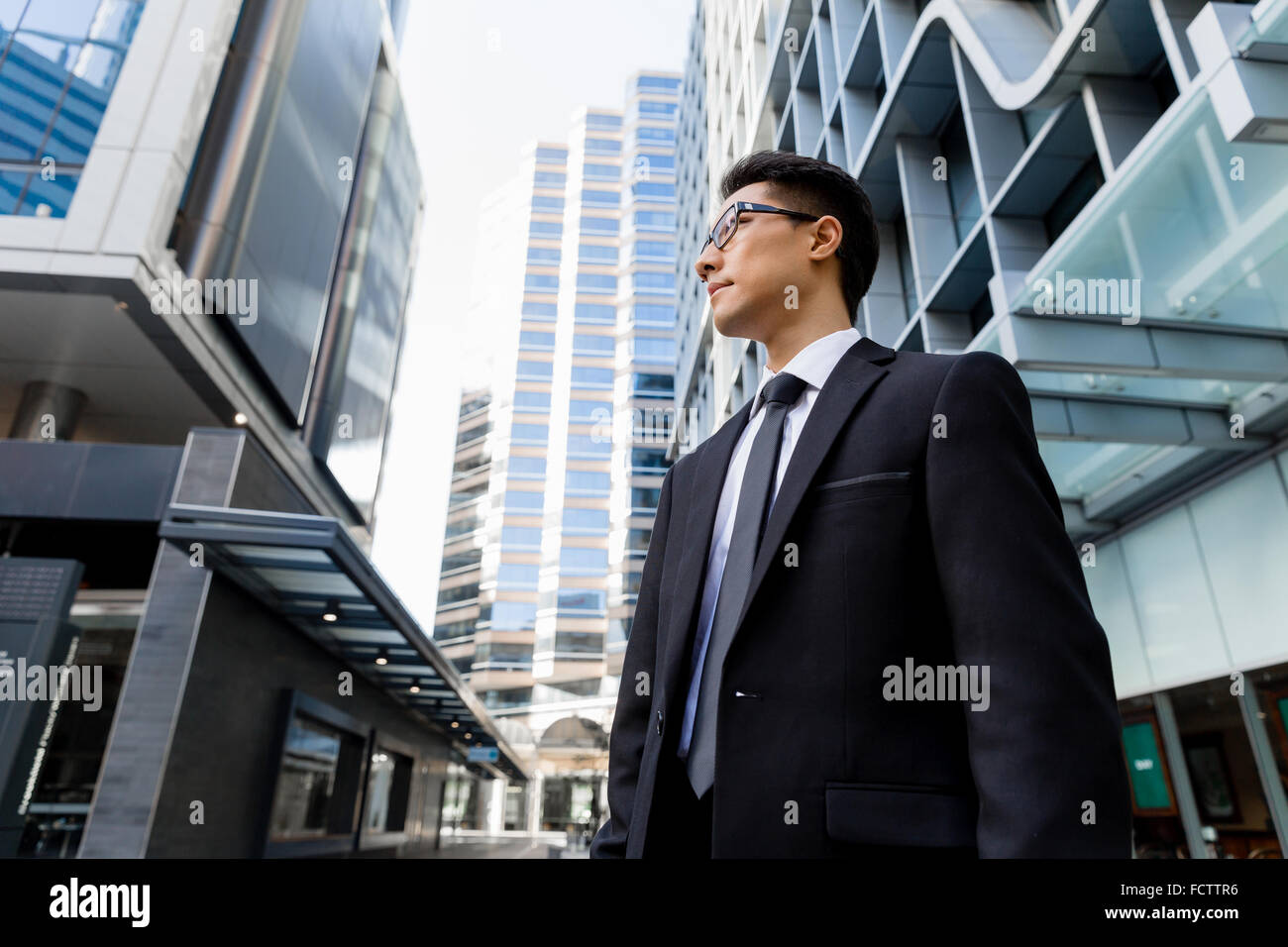Businessman outdoors in city business district Stock Photo - Alamy