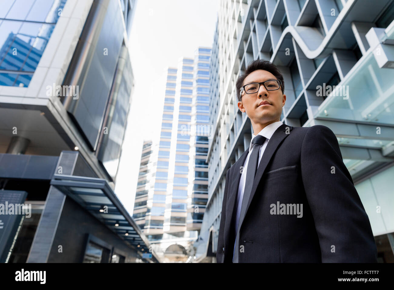 Businessman outdoors in city business district Stock Photo - Alamy