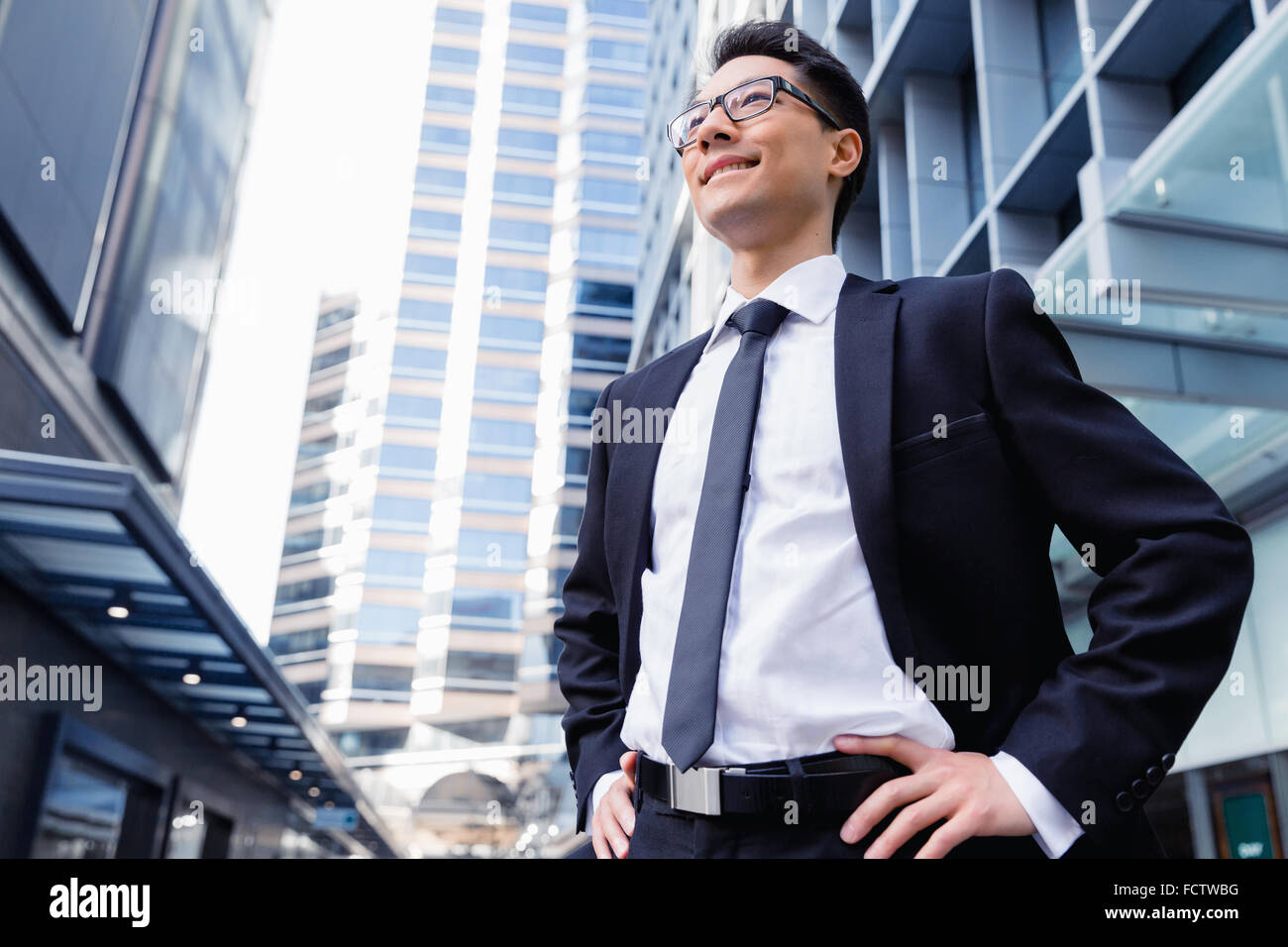 Businessman standing outdoors in city business district Stock Photo - Alamy