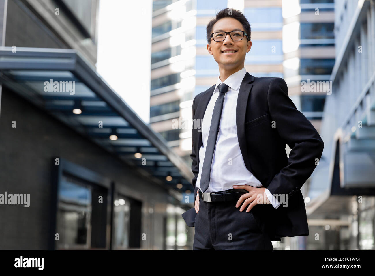 Businessman outdoors in city business district Stock Photo - Alamy