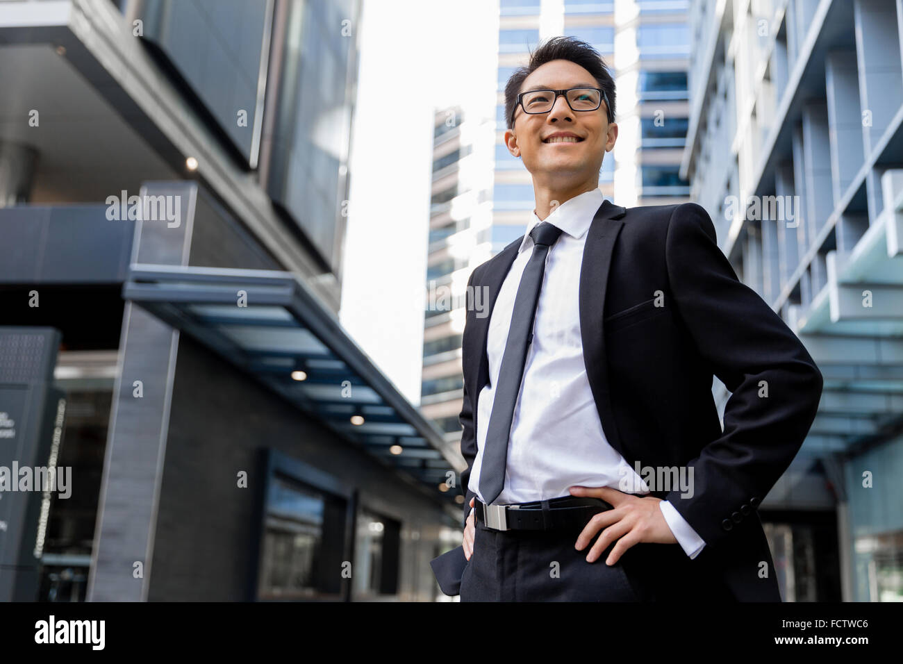 Businessman outdoors in city business district Stock Photo - Alamy
