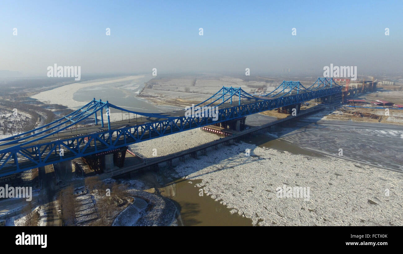 (160125) -- JINAN, Jan. 25, 2016 (Xinhua) -- Photo  taken on Jan. 25, 2016 shows the construction site of steel truss girder of Jinan Yellow River railway and highway combined bridge in Jinan, east China's Shandong Province. The double-deck bridge, with a two-way six-lane highway and four railway tracks, is a part of Shijiazhuang-Jinan passenger railway line.   (Xinhua/Xu Suhui)(mcg) Stock Photo
