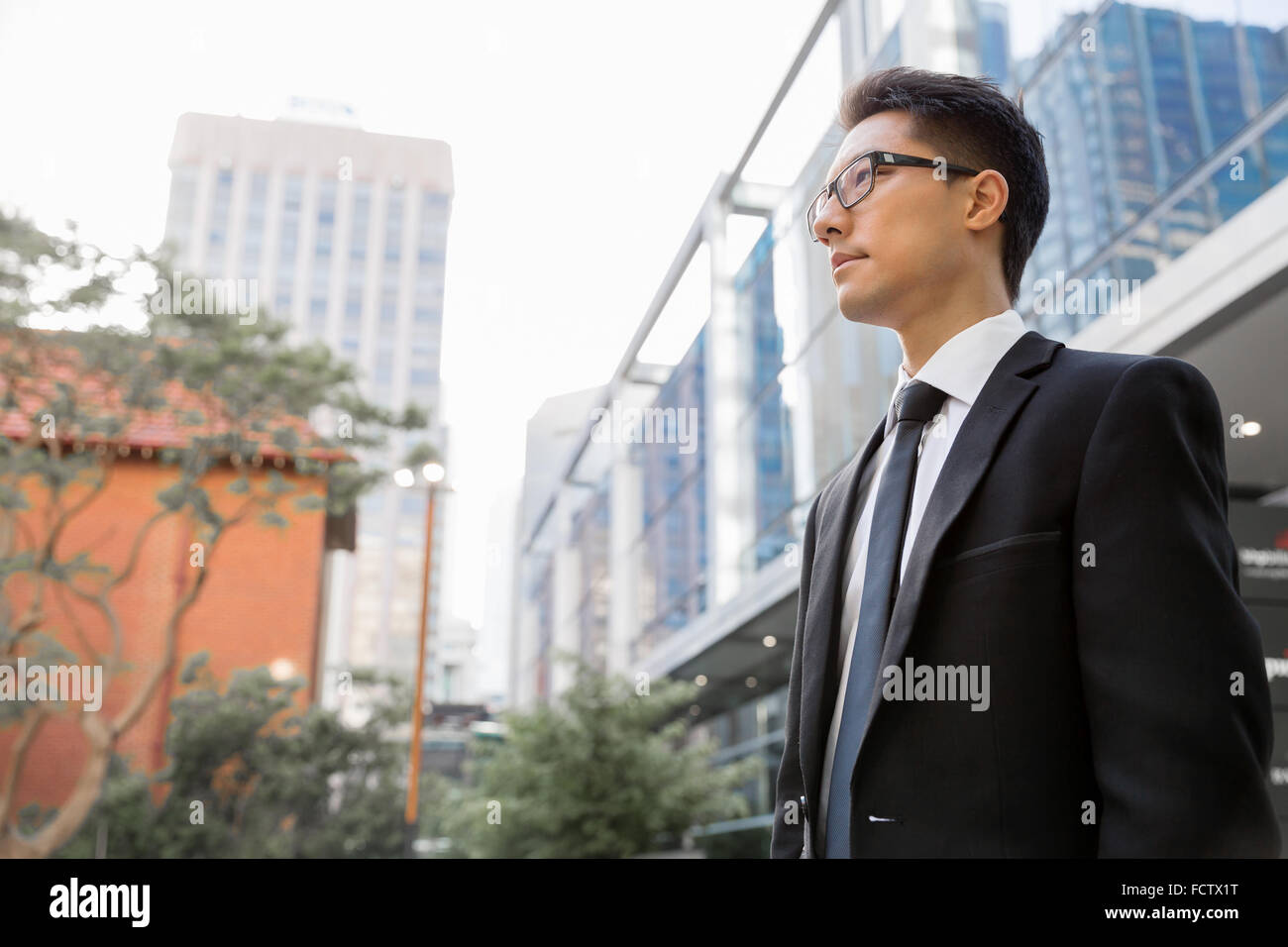 Businessman outdoors in city business district Stock Photo - Alamy