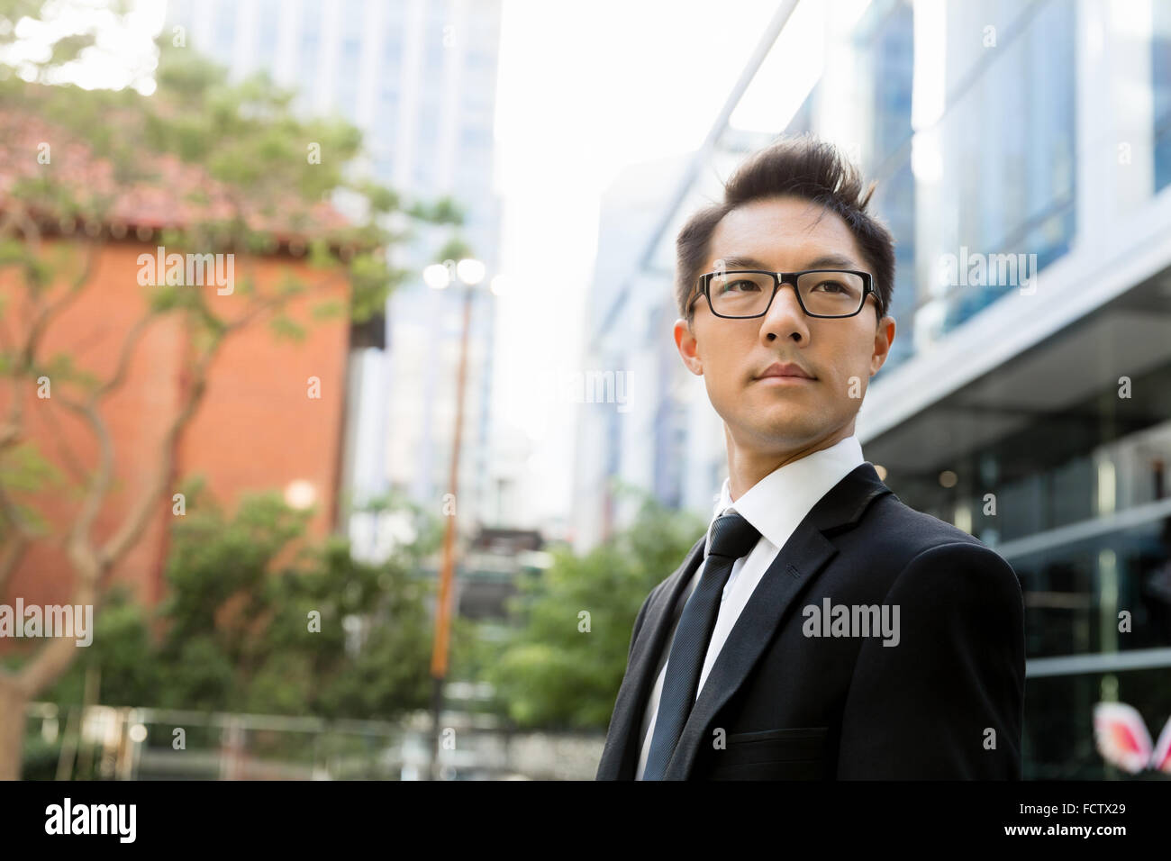 Businessman outdoors in city business district Stock Photo - Alamy
