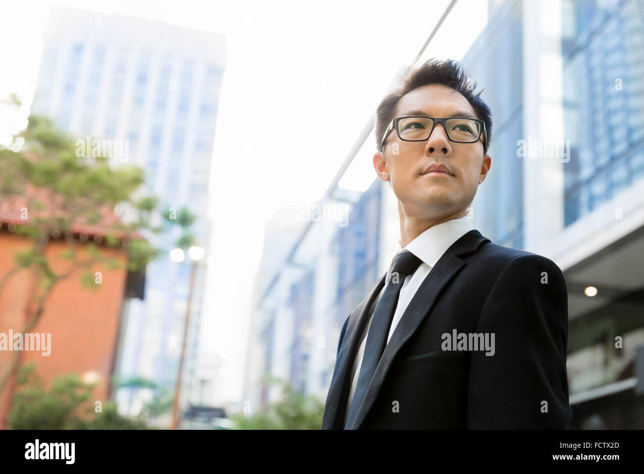 Businessman outdoors in city business district Stock Photo - Alamy