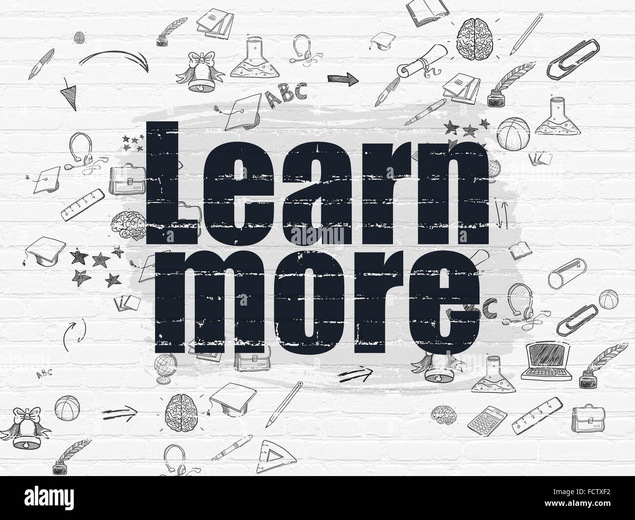 Studying concept: Learn More on wall background Stock Photo - Alamy