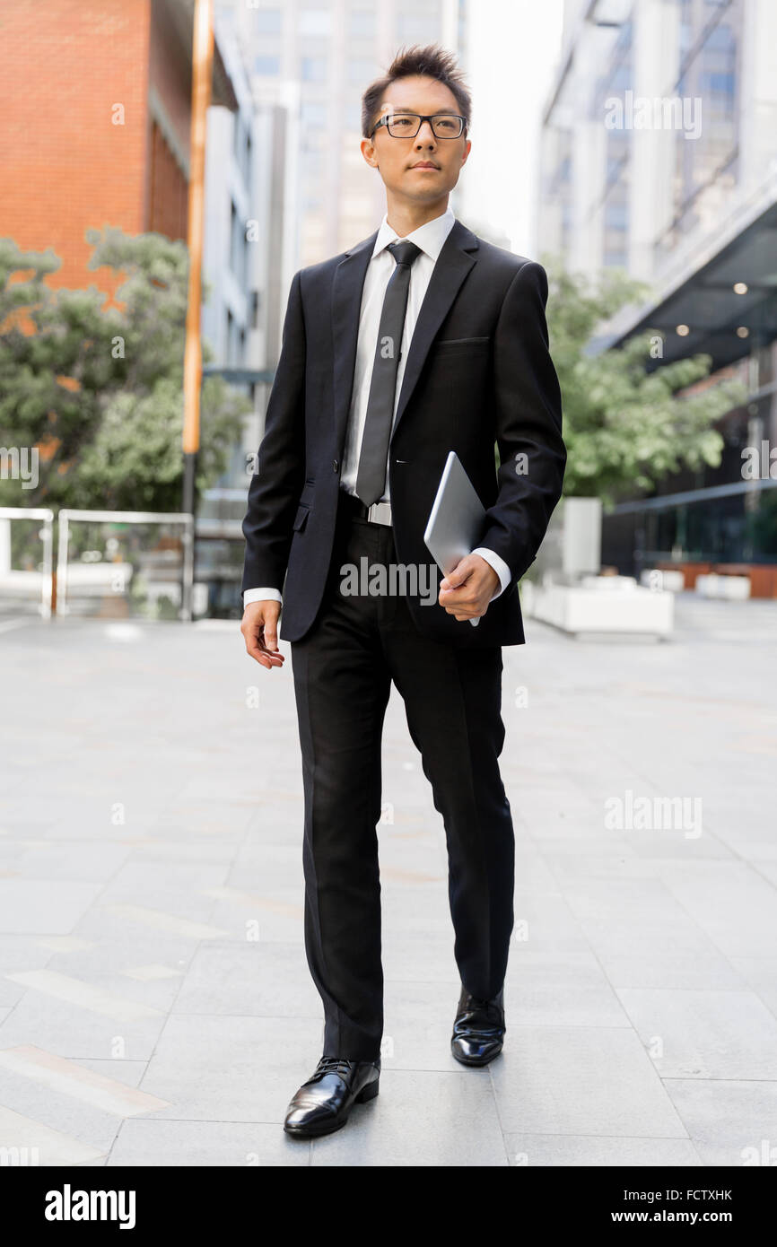 Businessman outdoors in city business district Stock Photo - Alamy
