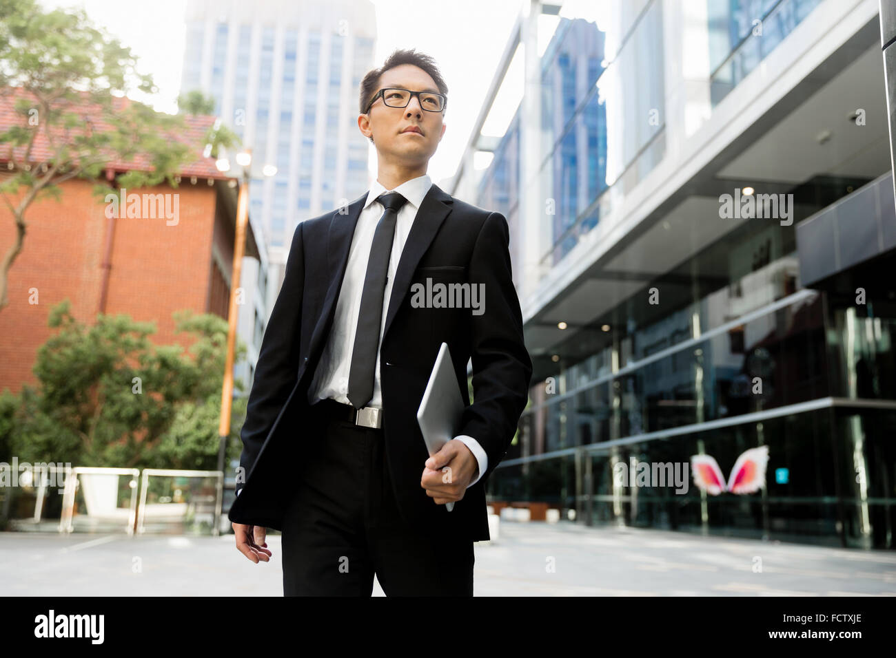 Businessman outdoors in city business district Stock Photo - Alamy