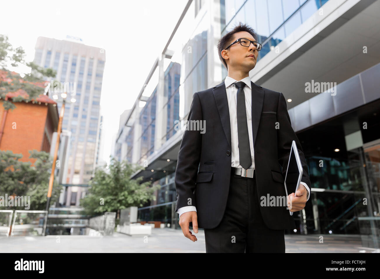 Businessman outdoors in city business district Stock Photo - Alamy