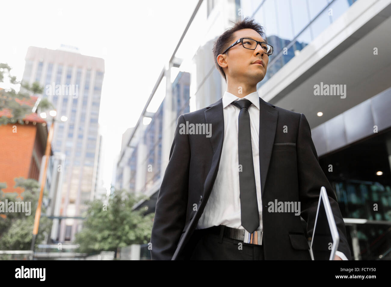 Businessman outdoors in city business district Stock Photo - Alamy