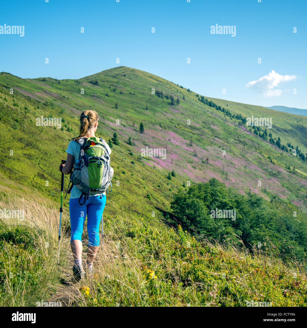 Young woman hiking in the mountains Stock Photo - Alamy