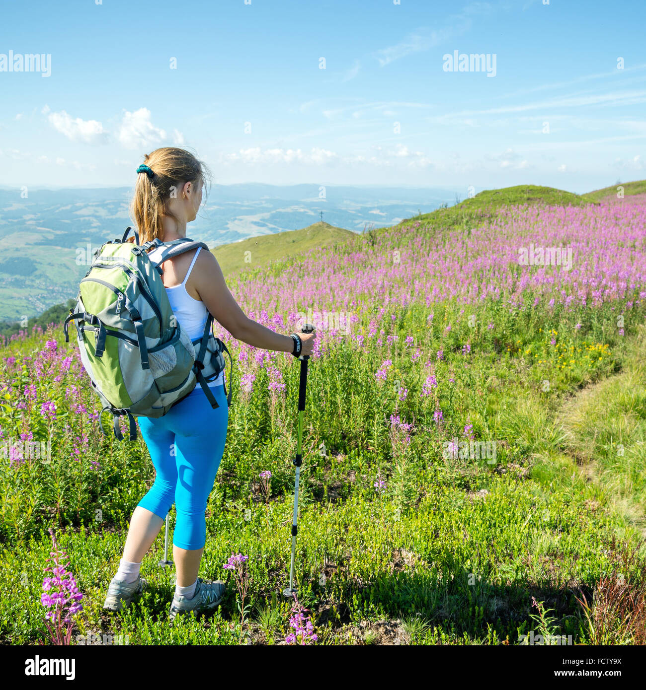 Young woman hiking in the mountains Stock Photo - Alamy