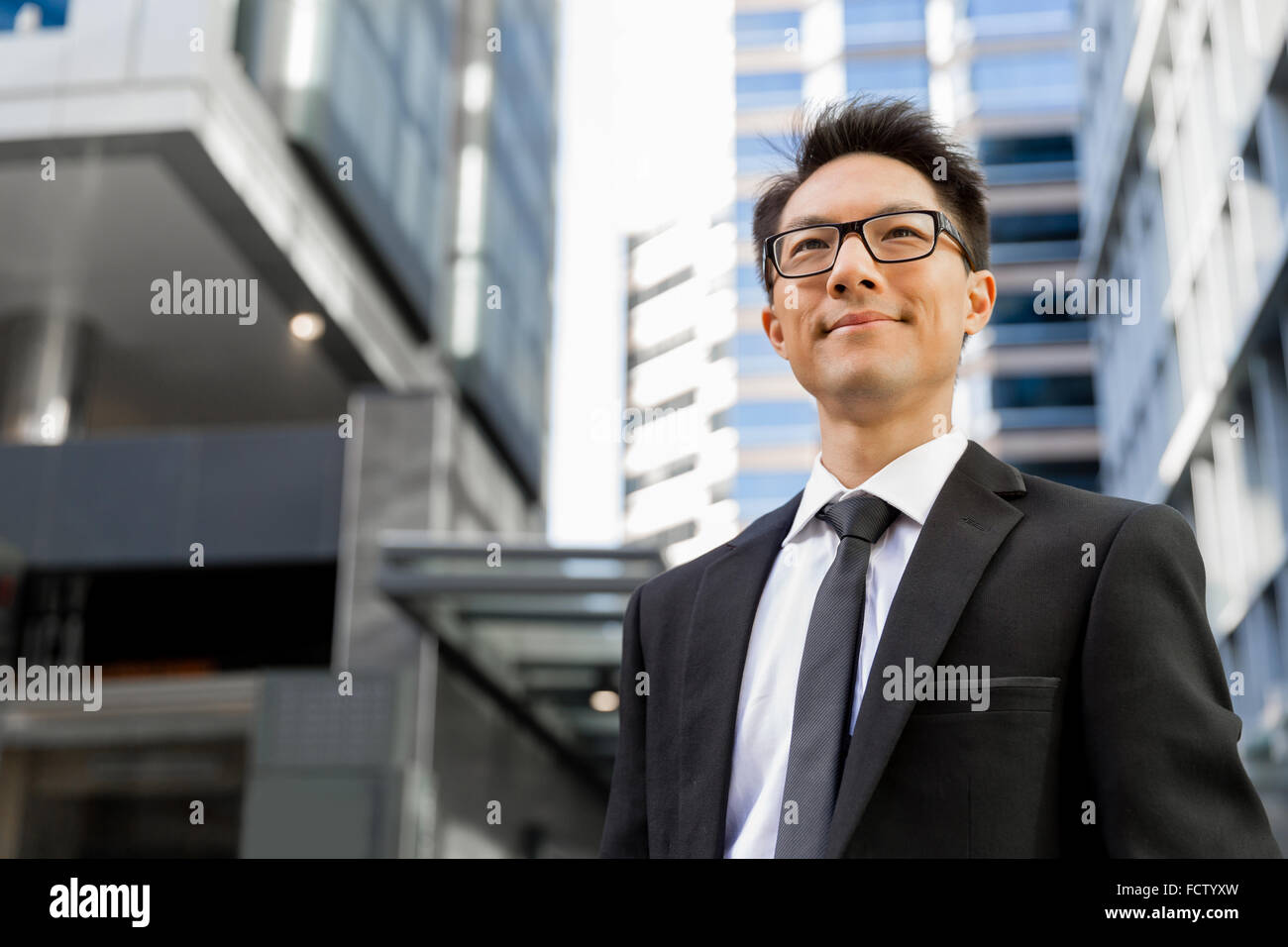 Businessman outdoors in city business district Stock Photo - Alamy