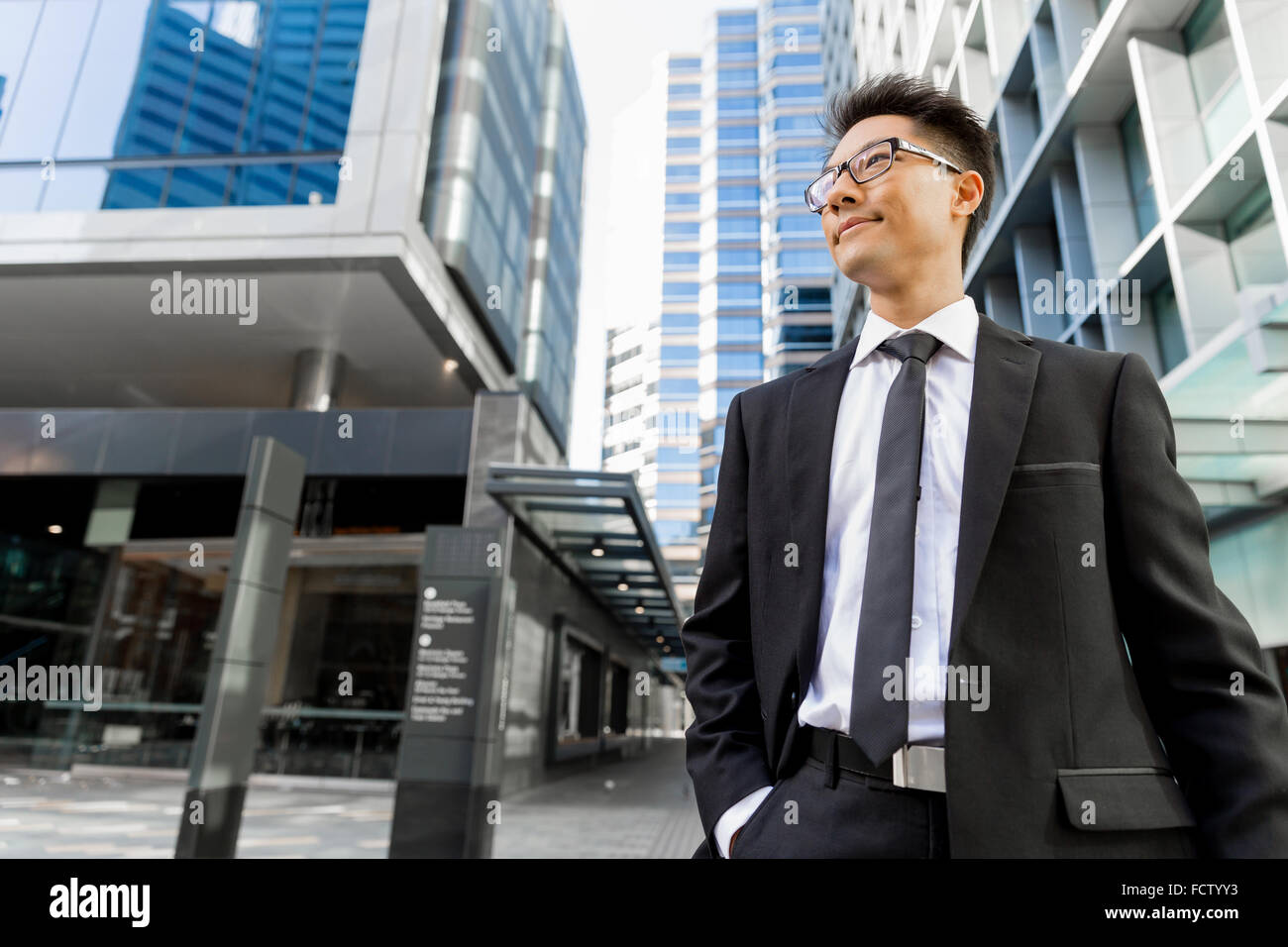 Businessman outdoors in city business district Stock Photo - Alamy