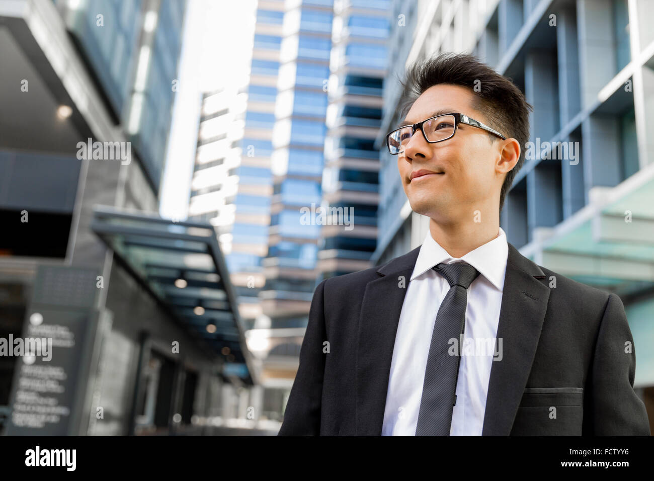 Businessman outdoors in city business district Stock Photo - Alamy