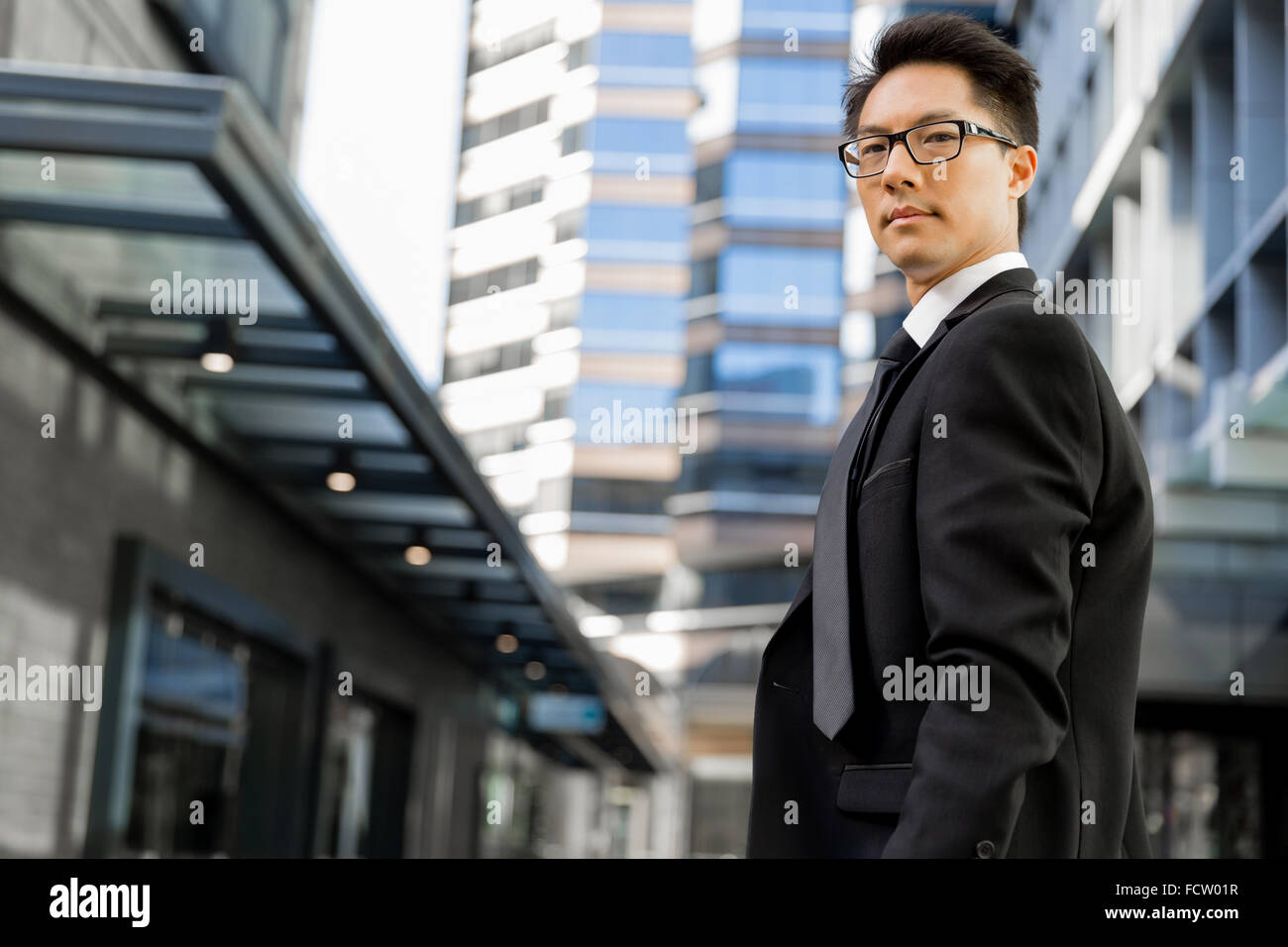 Businessman outdoors in city business district Stock Photo - Alamy