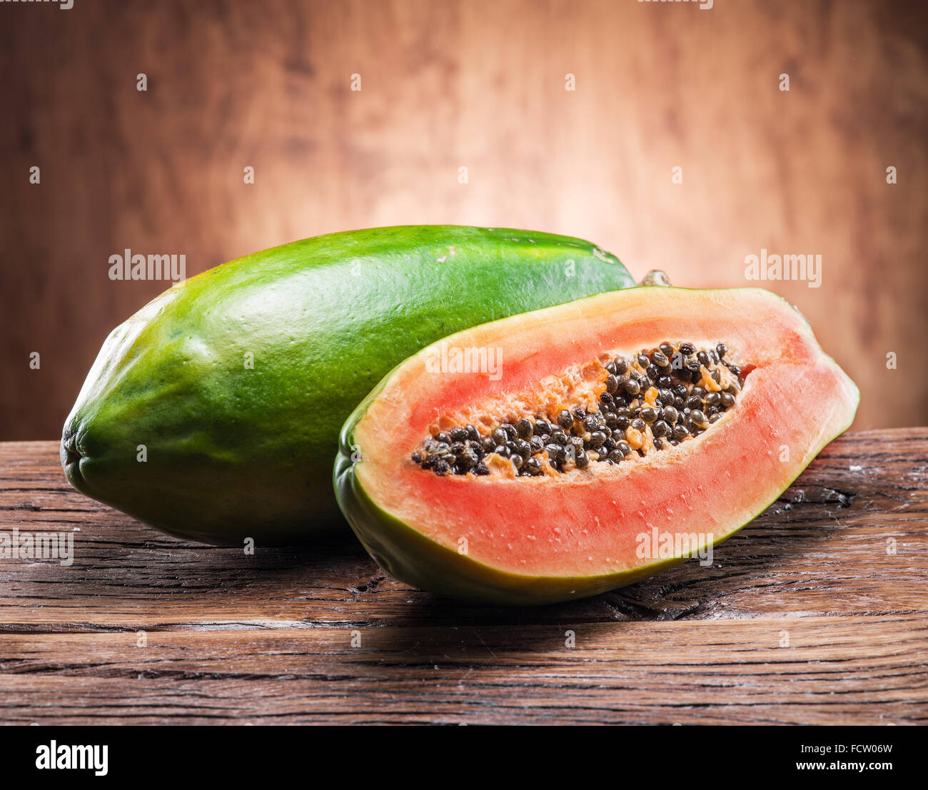 Papaya fruit on wooden background. Stock Photo