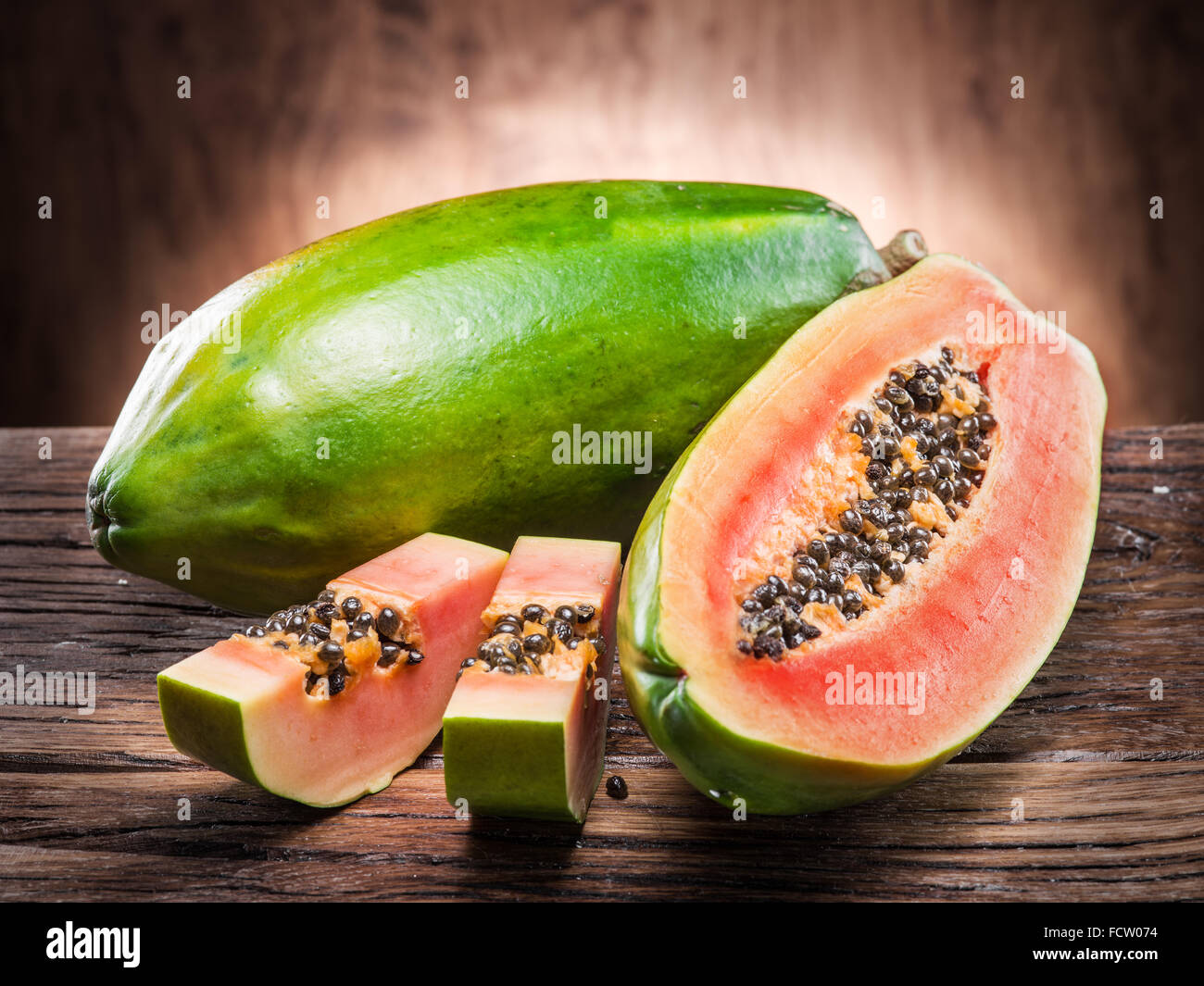Papaya fruit on wooden background. Stock Photo