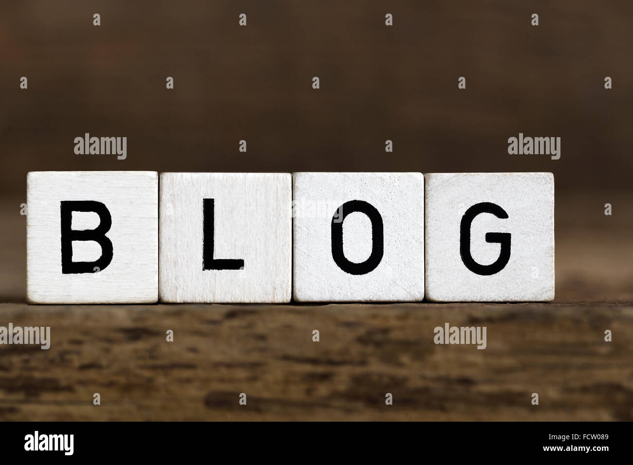 The word blog written in cubes on wooden background Stock Photo