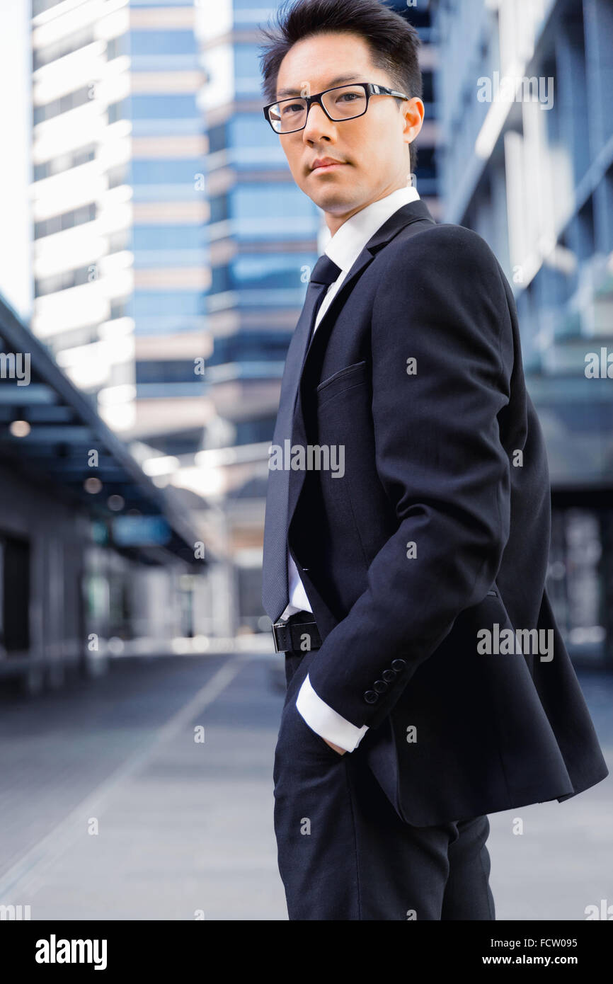 Businessman standing outdoors in city business district Stock Photo - Alamy