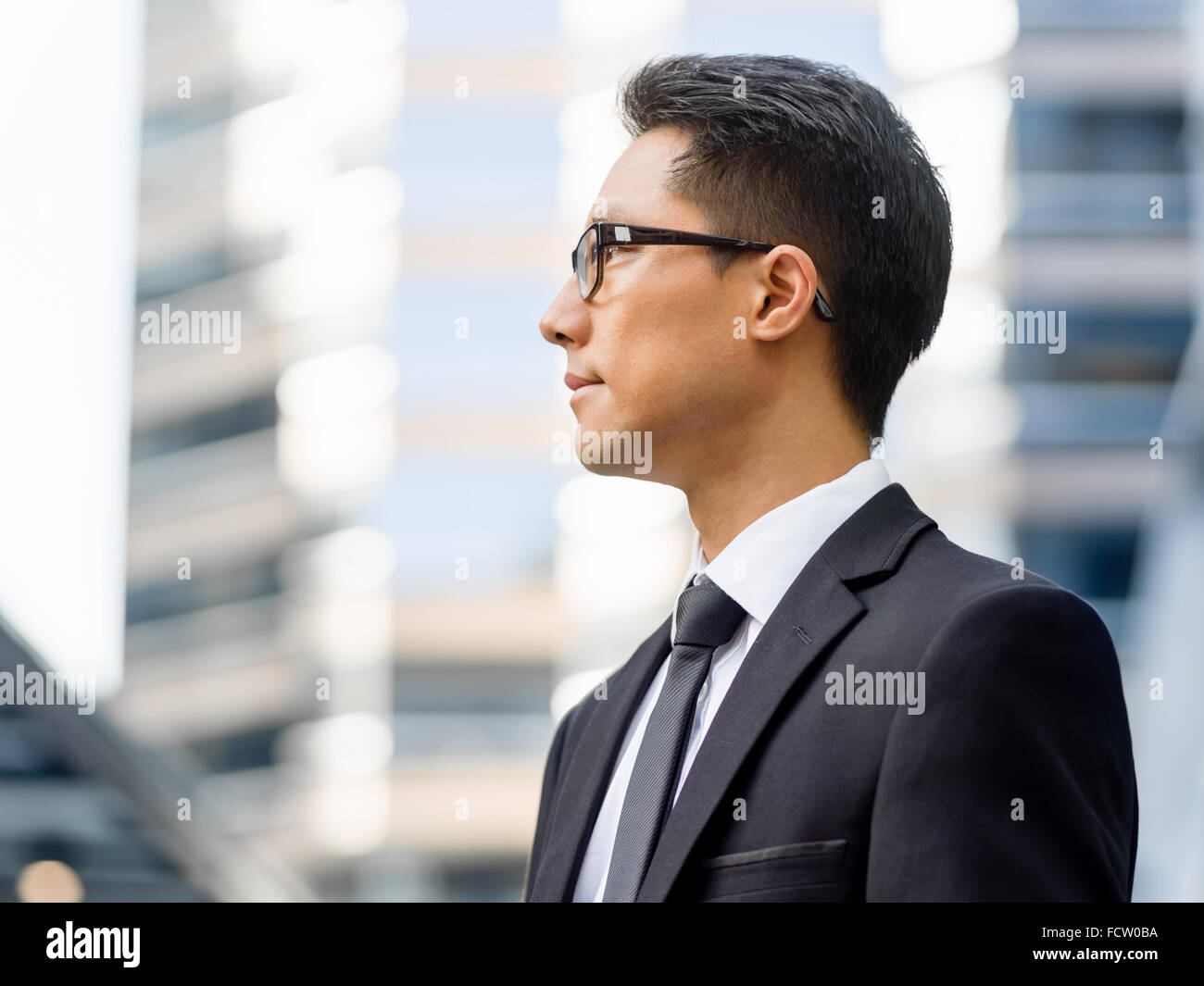 Businessman outdoors in city business district Stock Photo - Alamy