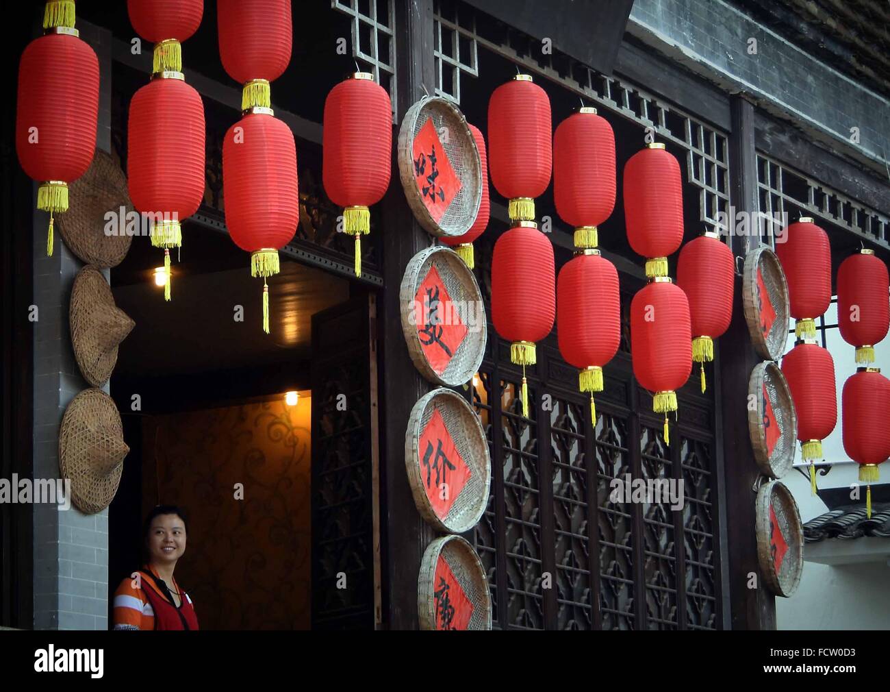 (160125) -- BEIJING, Jan. 25, 2016 (Xinhua) -- Lanterns are hung on the eave of a restaurant in Likeng Village in Wuyuan County, east China's Jiangxi Province, April 1, 2015. Lanterns in China have a long history and they have become synonymous with Chinese culture. Even today, they are still made and enjoyed by the Chinese worldwide. They were used as a means of artistic expression, in terms of functionality, design and decoration. Chinese streets in both cities and towns are decorated with red lanterns during festivals, especially Chinese Lunar New Year, Mid-Autumn Festival and Lantern Festi Stock Photo