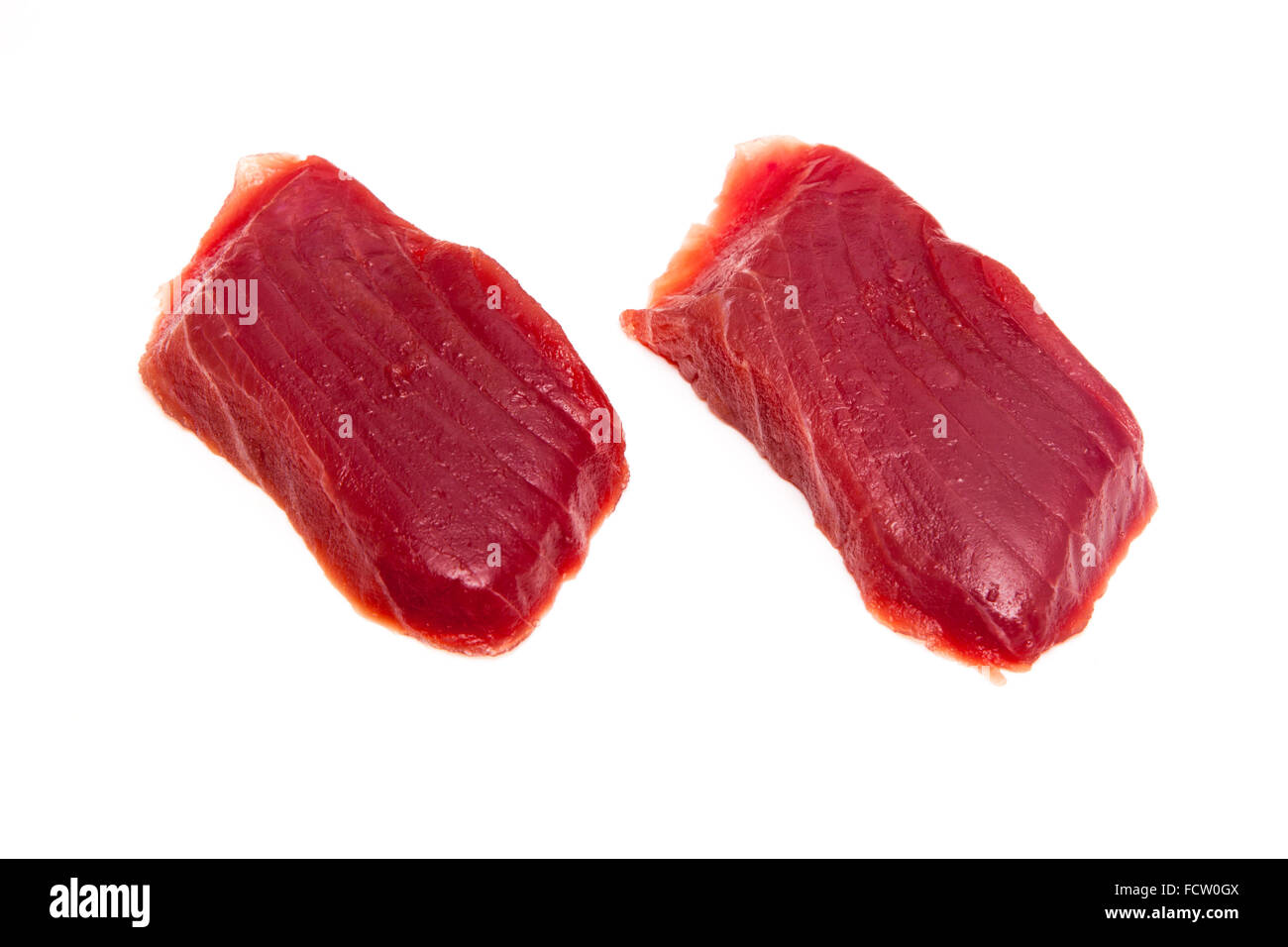Yellowfin tuna fish steaks (thunnus albacares) isolated on a white studio background. Stock Photo