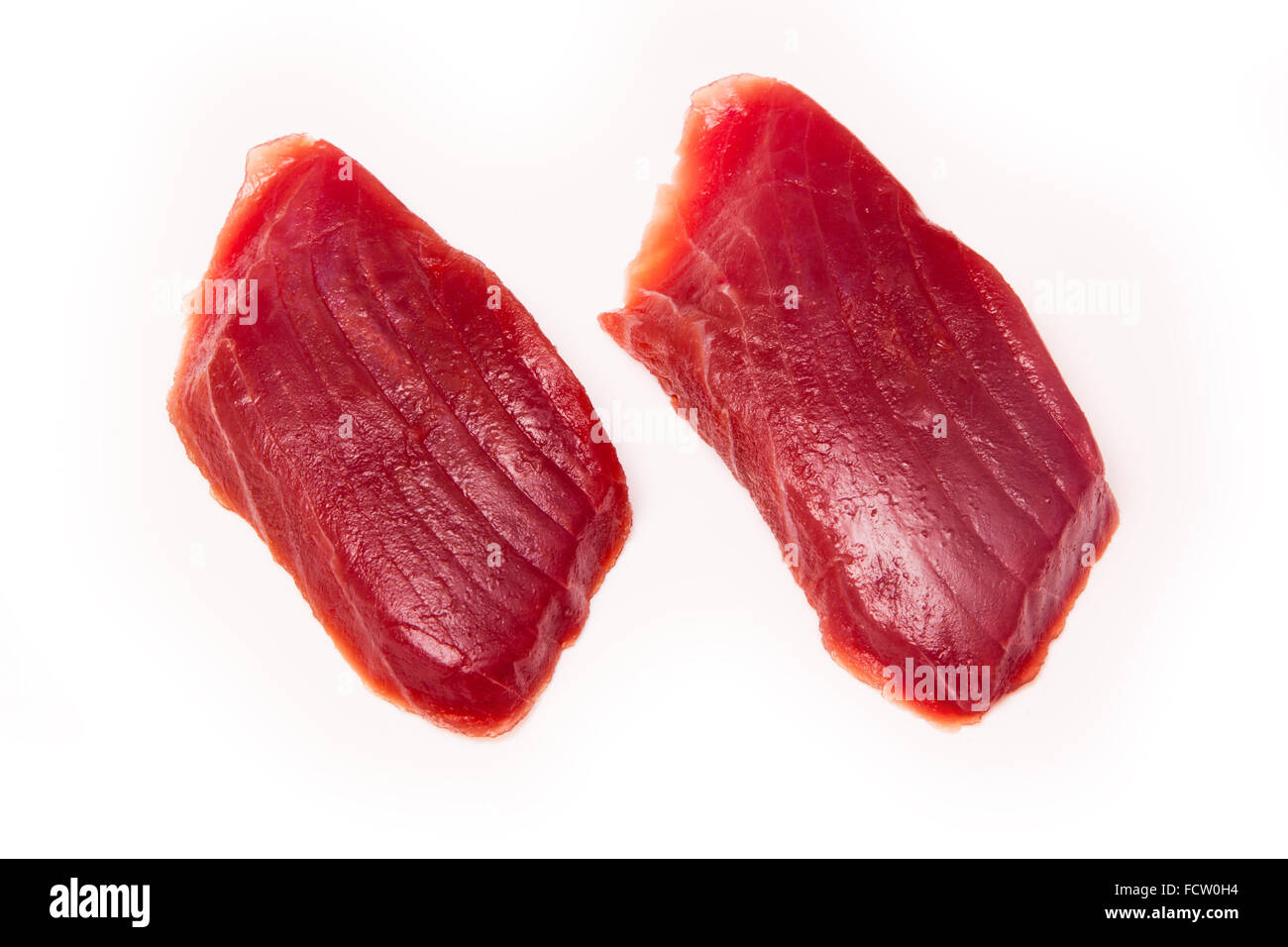 Yellowfin tuna fish steaks (thunnus albacares) isolated on a white studio background. Stock Photo