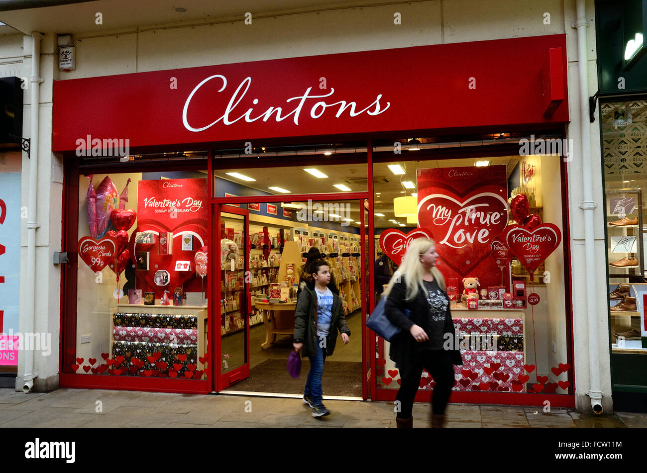 A view of a couple of customers leaving the Clintons  Cards store in Windsor, Berkshire Stock Photo
