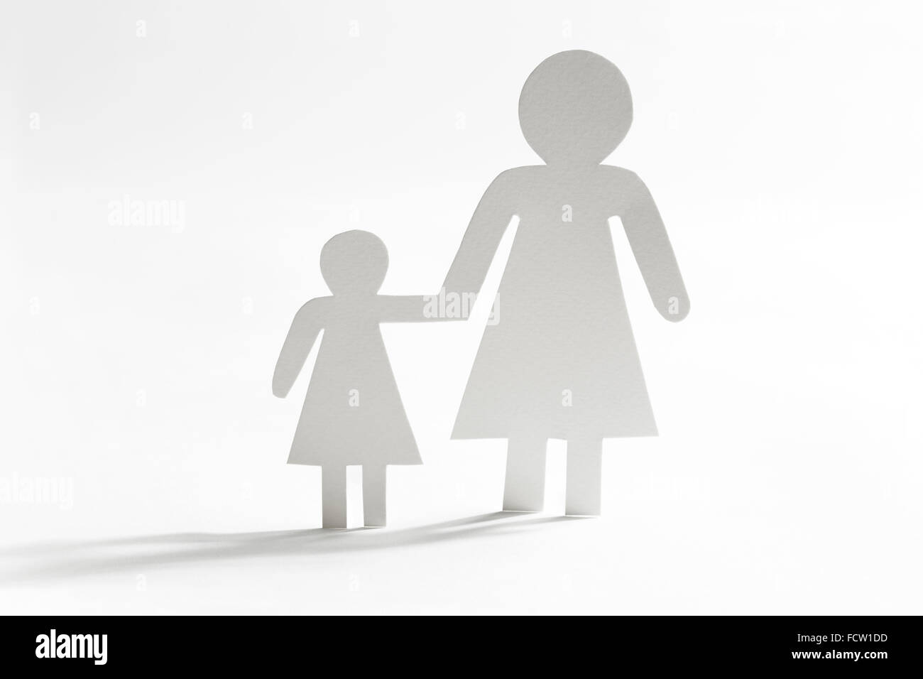 Single mother with daughter, paper figures Stock Photo