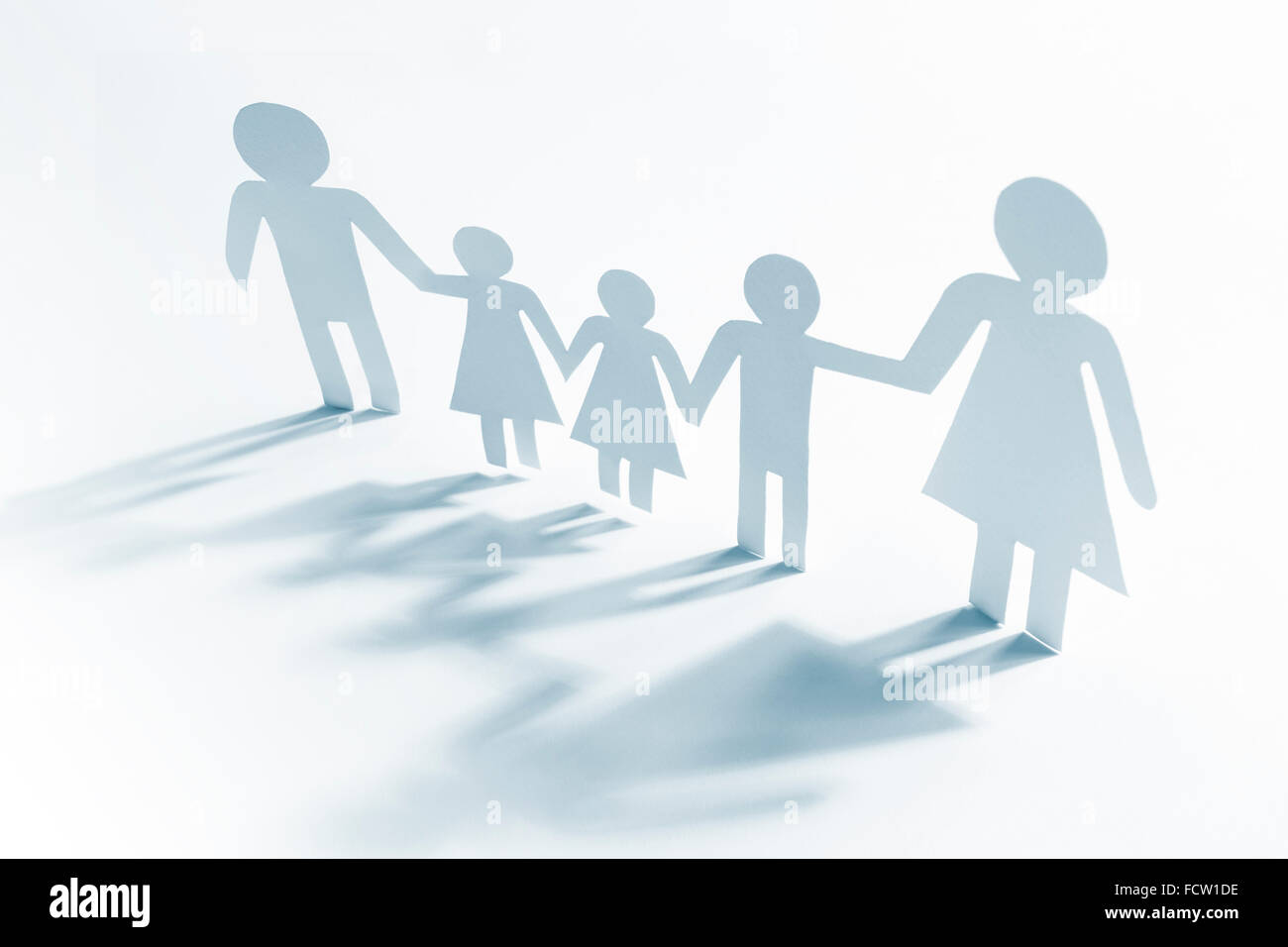 Single mother with four children, paper figures Stock Photo