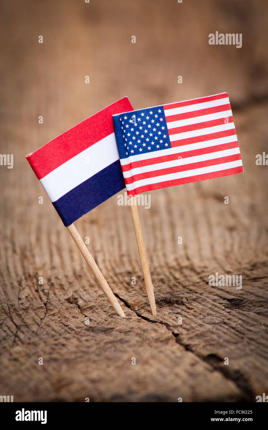 Flags of Netherlands and USA on wooden background Stock Photo