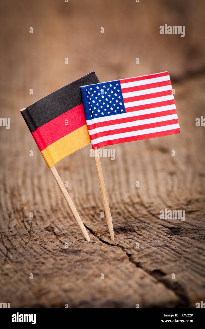 Flags of USA and Germany on wooden background Stock Photo