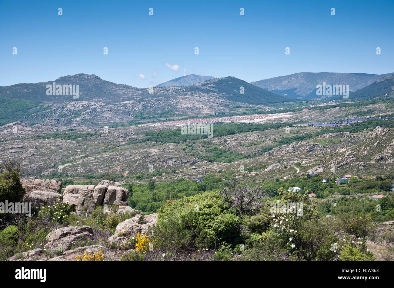 Urbanization at foot of the mountain in Guadarrama Mountains, Madrid, Spain Stock Photo
