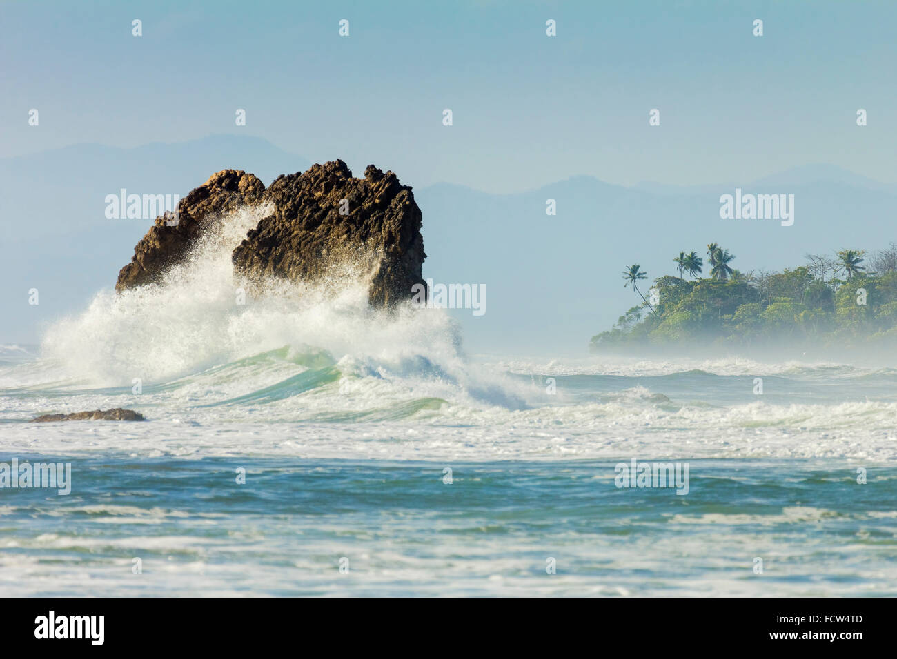 Surf on a sea stack between Santa Teresa & Hermosa beaches on the Nicoya Peninsula; Santa Teresa