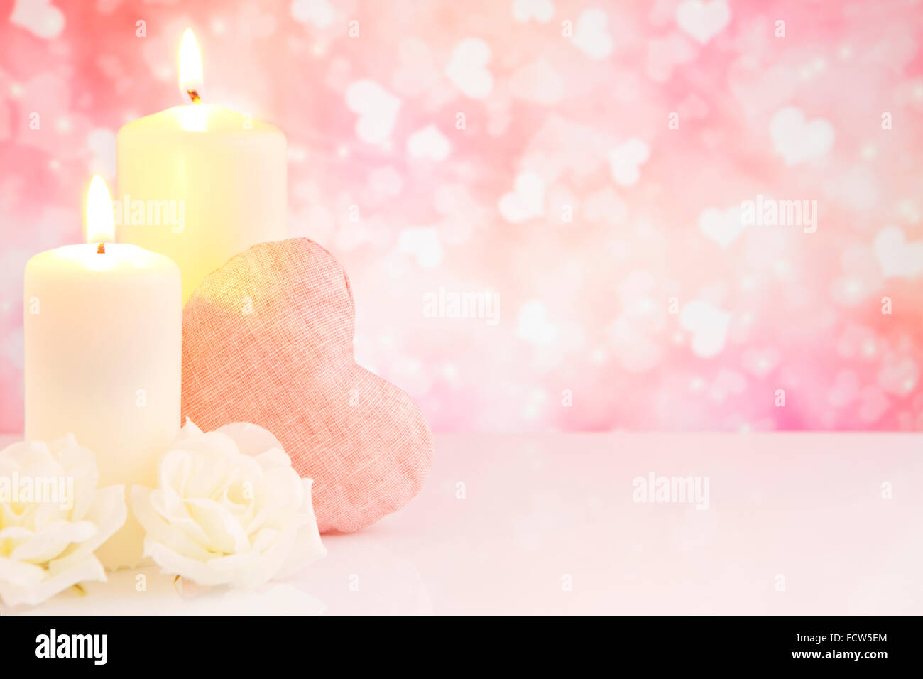 Valentine's hearts, candles and roses with a bright glittering ...