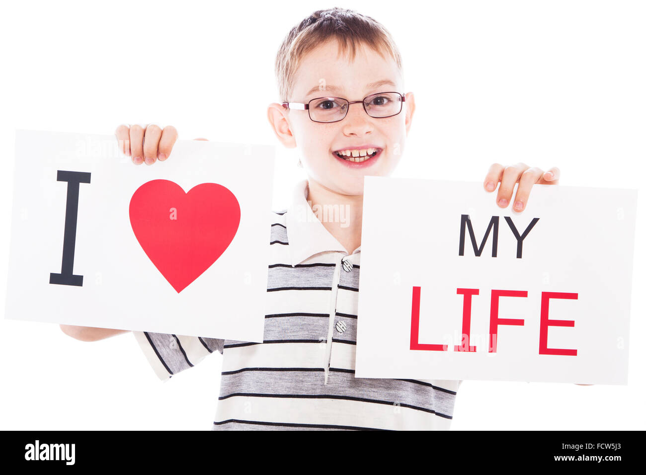 Happy boy with sign Stock Photo - Alamy