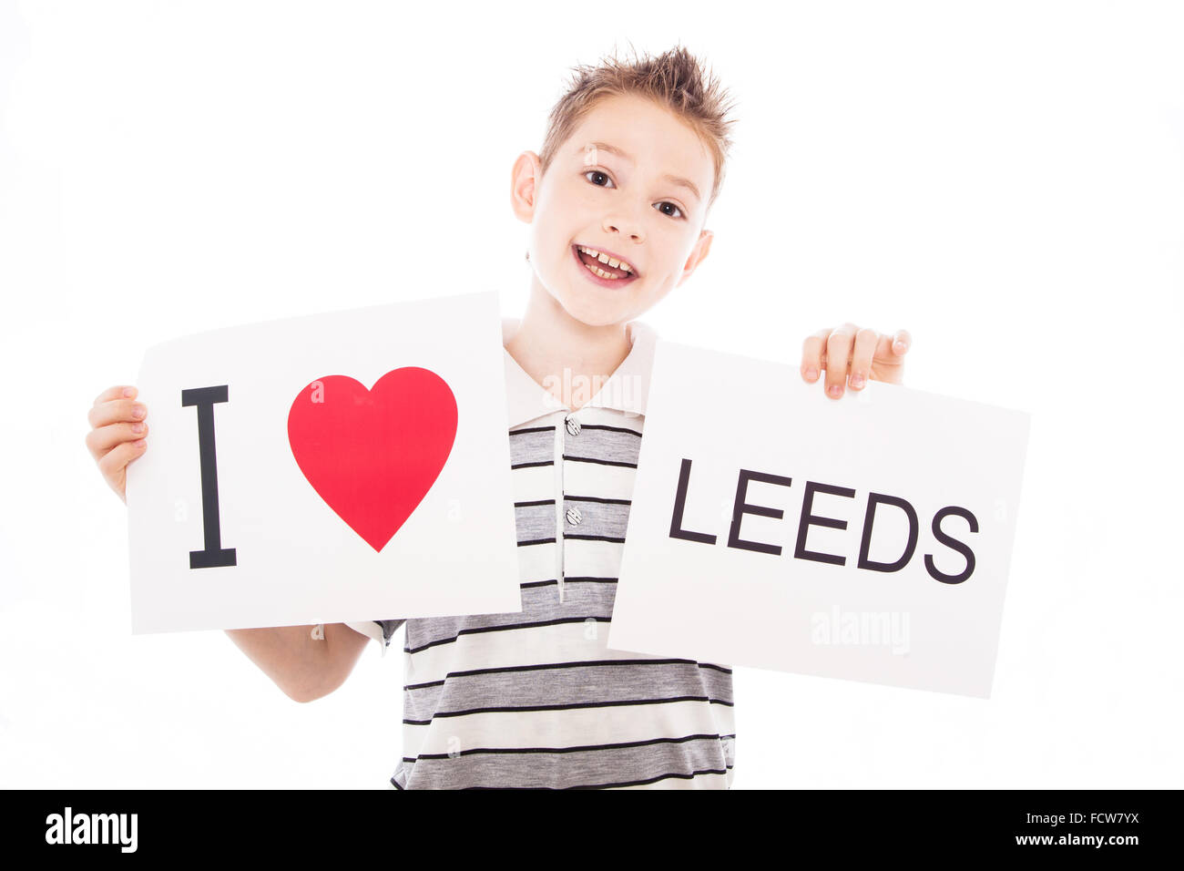 Boy with city sign Leeds Stock Photo - Alamy
