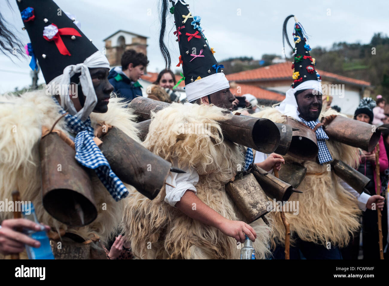 The zarramacos walking with their campanos the village streets of Silio (Cantabria) during the first carnival of the year. Stock Photo