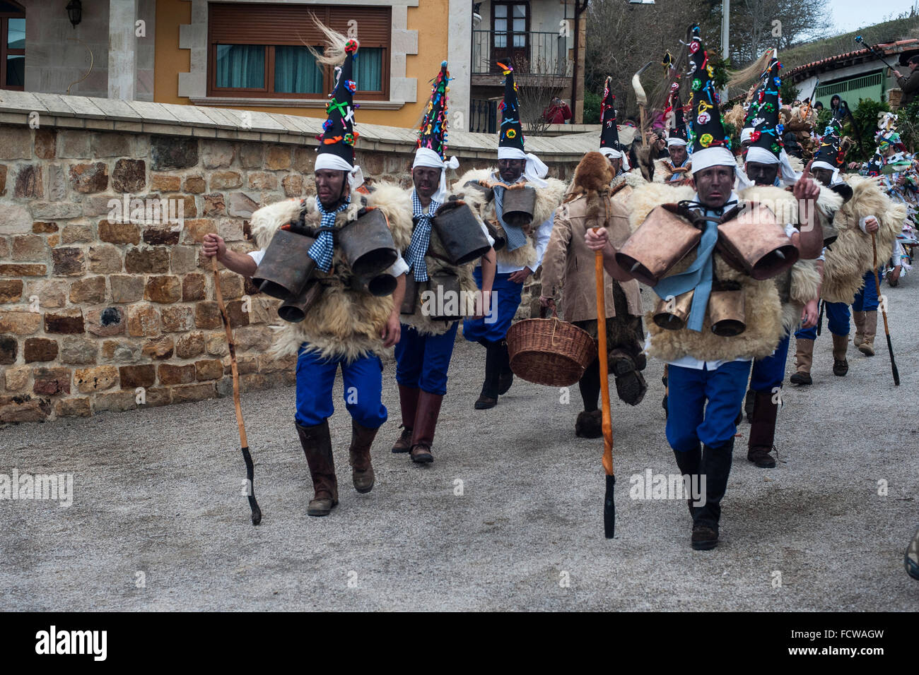 The zarramacos walking with their campanos the village streets of Silio (Cantabria) during the first carnival of the year. Stock Photo